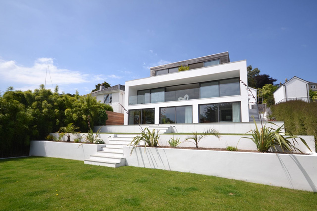 The front of Salt House, St Ives, with steps and a lawn in front